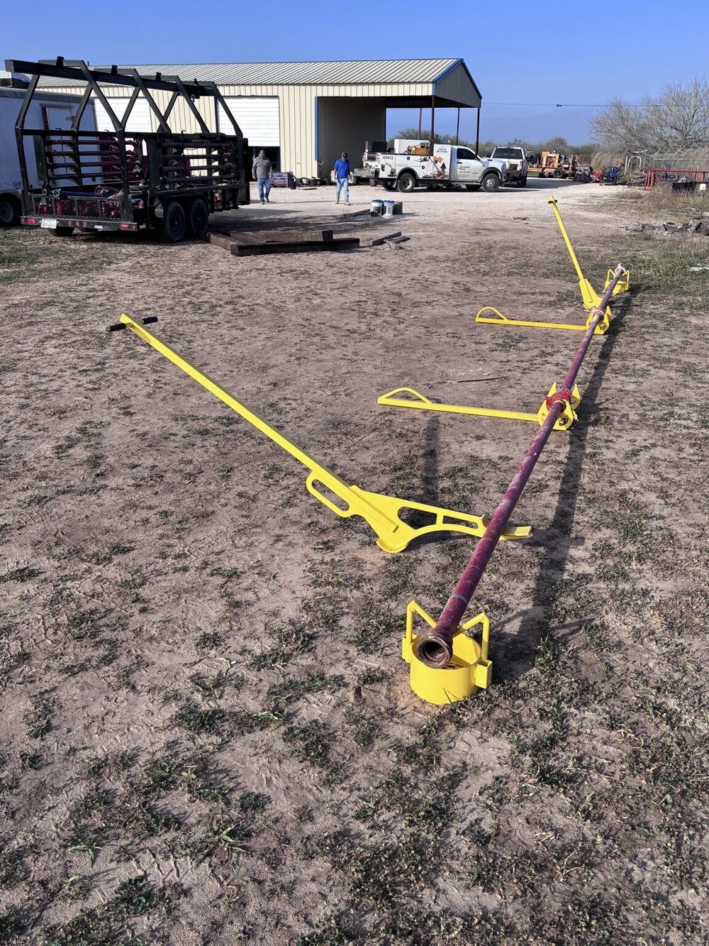 Basket Stands supporting a long section of flow iron