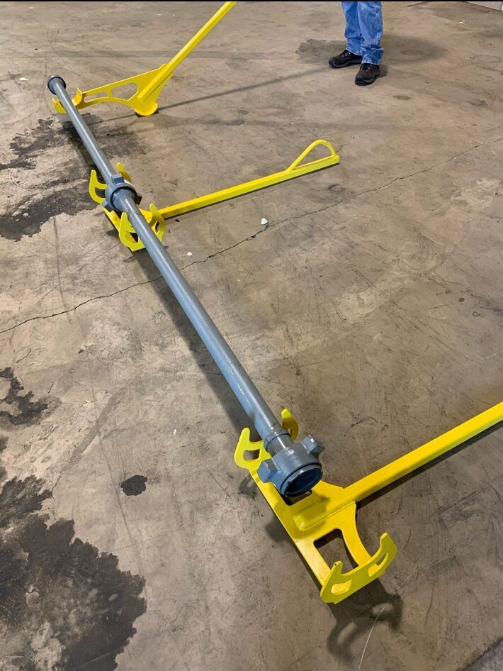 Hammer Stand system supporting pipe in a shop